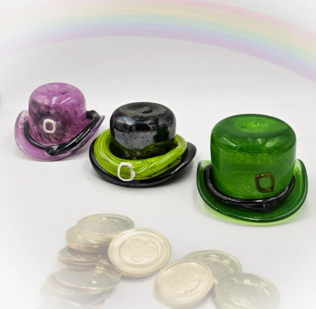 Now through the month of March, with the help of our professional glassblowers, you will sculpt hot, molten glass into a glass leprechaun hat (Irish Cap) in our HotShop. Five years or older. $50 per person. Reservations are required by phone (513-751-3292), email (neusoleglassworks@hotmail.com), or in person. Scheduled in 30-minute increments. Payment is required at the time of scheduling. Available for pick-up in approximately seven days. #neusoleglassworkscreate #StPatricksDay #green #irish #greenglass #leprechaun #March #lucky A good laugh and glassblowing are the two best cures for everything ( – somewhat changed Irish proverb)