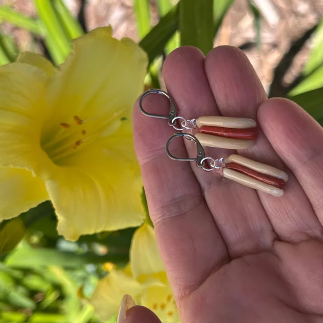 Hotdog leverback flameworked earrings,
online https://neusole-glassworks.square.site/s/search?q=hotdog 
and in our giftshop $25