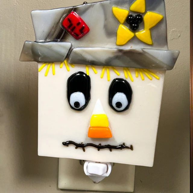Create a scarecrow nightlight in our fused glass class. Approx: 5''wide x 5''tall. All ages welcome, no experience needed. Approx: 1 hour. $55 per nightlight. Call 513-751-3292 to reserve your time, or email neusoleglassworks@hotmail.com. Payment due upon scheduling. Item available for pick up in approximately one week. #neusoleglassworks #nonprofit #scarecrow #nightlight #glassfusing #fallfun #funinthenati #cincinnati